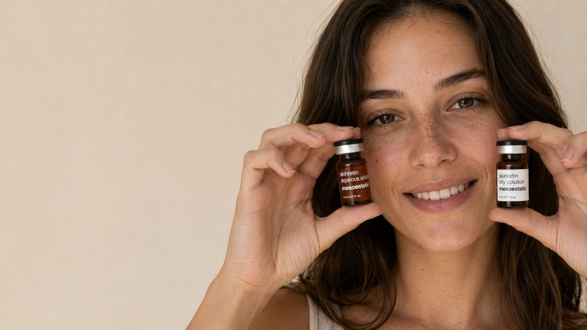Woman holding Mesoestetic Skinretin professional skin treatment products