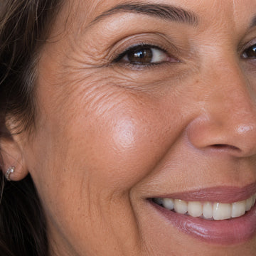 Close-up of a woman's face with a focus on her skin texture.