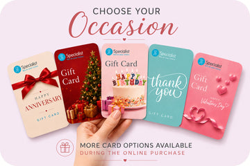 A promotional graphic showing five Specialist gift cards in different designs held in a hand against a pale pink background. The cards include Anniversary, Christmas, Happy Birthday, thank you, and Valentine's Day options, with text reading 'CHOOSE YOUR OCCASION' and 'MORE CARD OPTIONS AVAILABLE DURING THE ONLINE PURCHASE'.